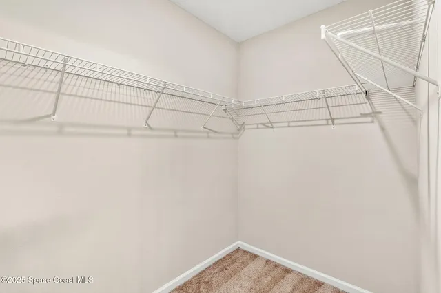 a view of a room with racks on the wall