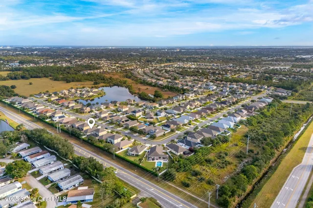 an aerial view of city and lake