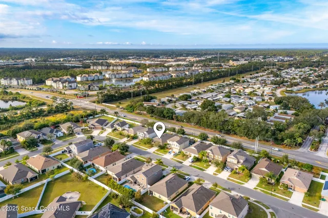 an aerial view of residential building with parking space