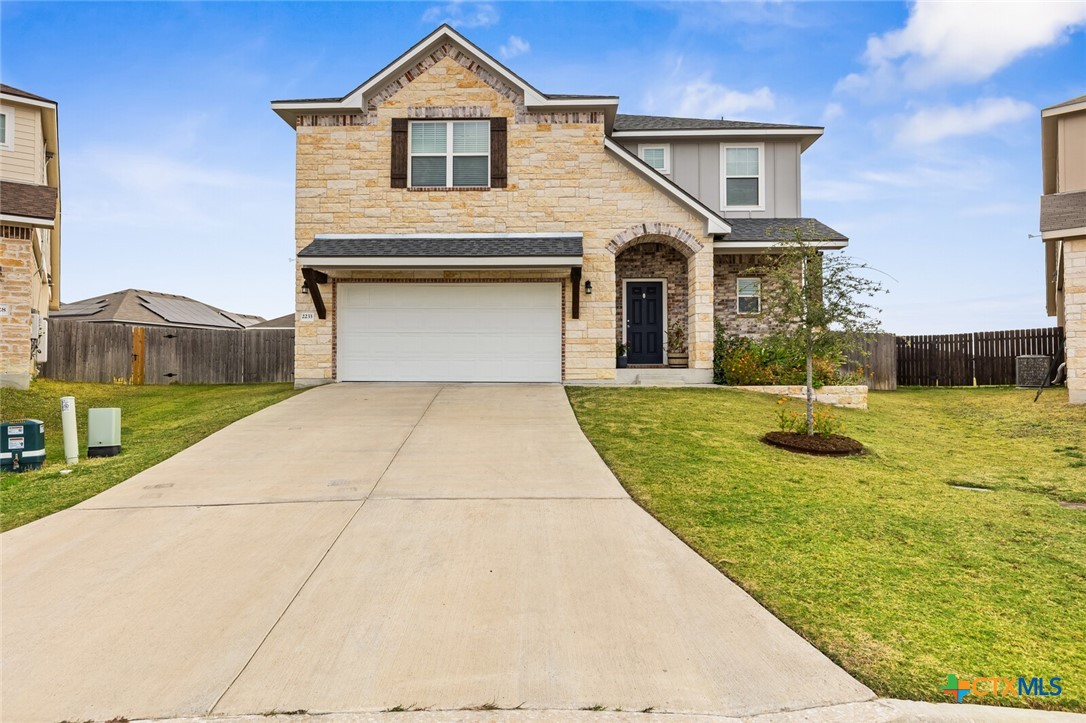 2233 Chia Court Temple, TX 76501 - Photo 2 of 47 a front view of a house with a yard