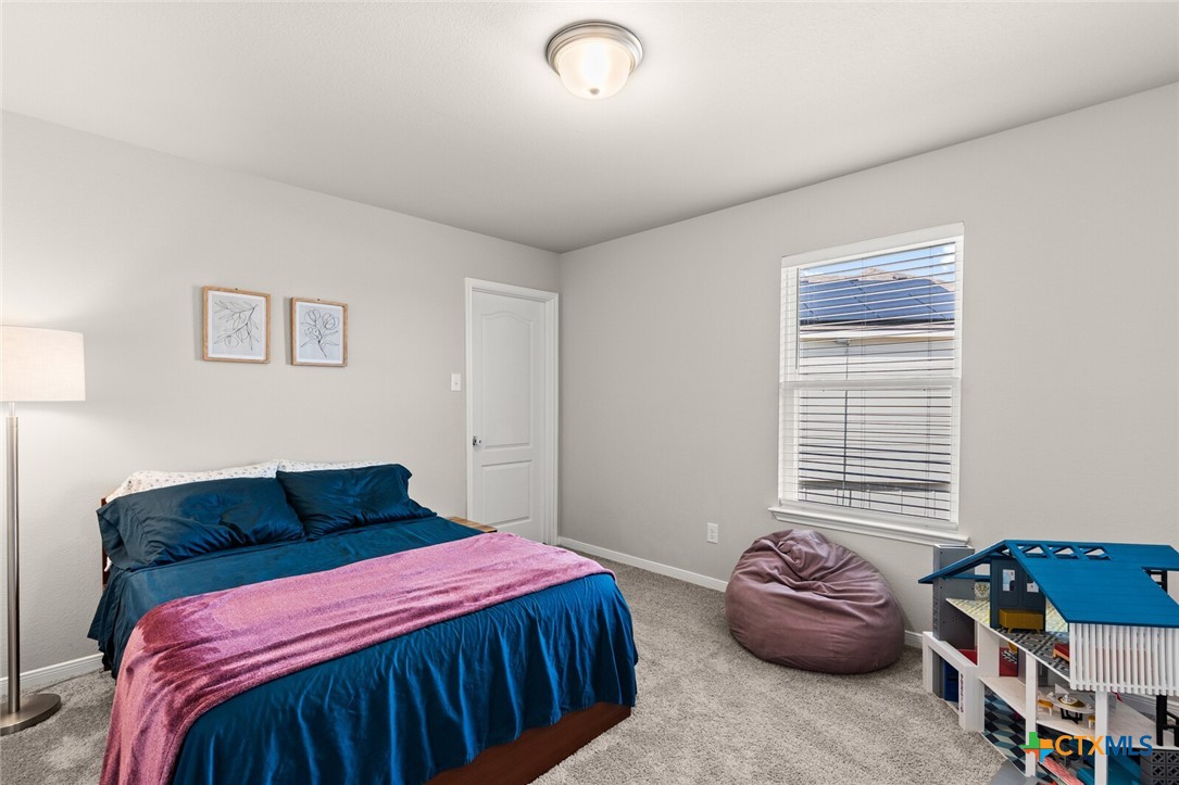 2233 Chia Court Temple, TX 76501 - Photo 27 of 47 a bedroom with a bed and a window