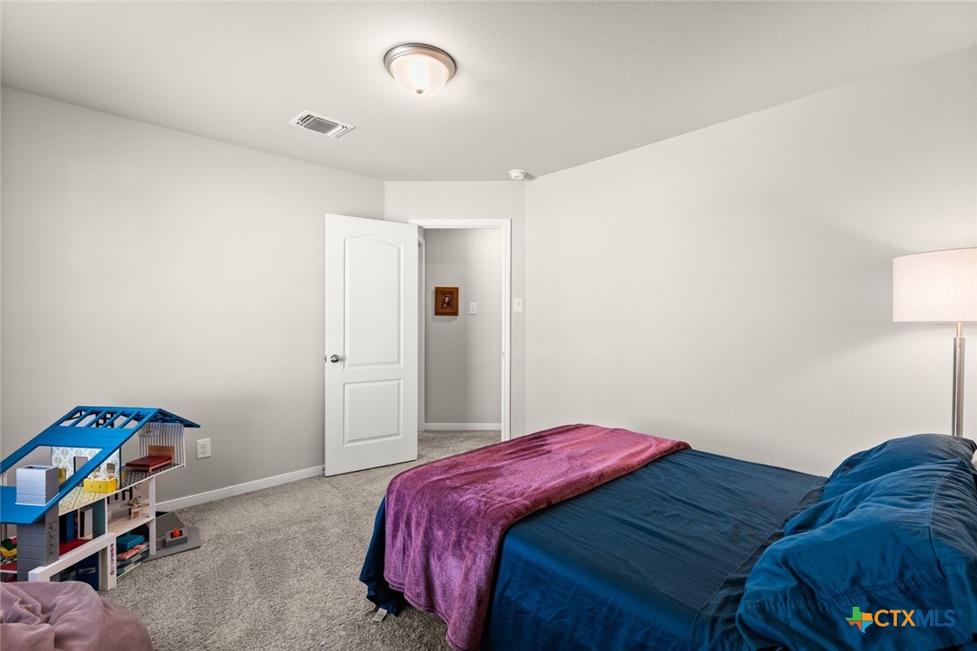 2233 Chia Court Temple, TX 76501 - Photo 28 of 47 a bedroom with a bed and a dresser