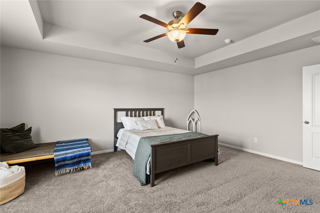 2233 Chia Court Temple, TX 76501 - Photo 33 of 47 a bedroom with a bed and a ceiling fan