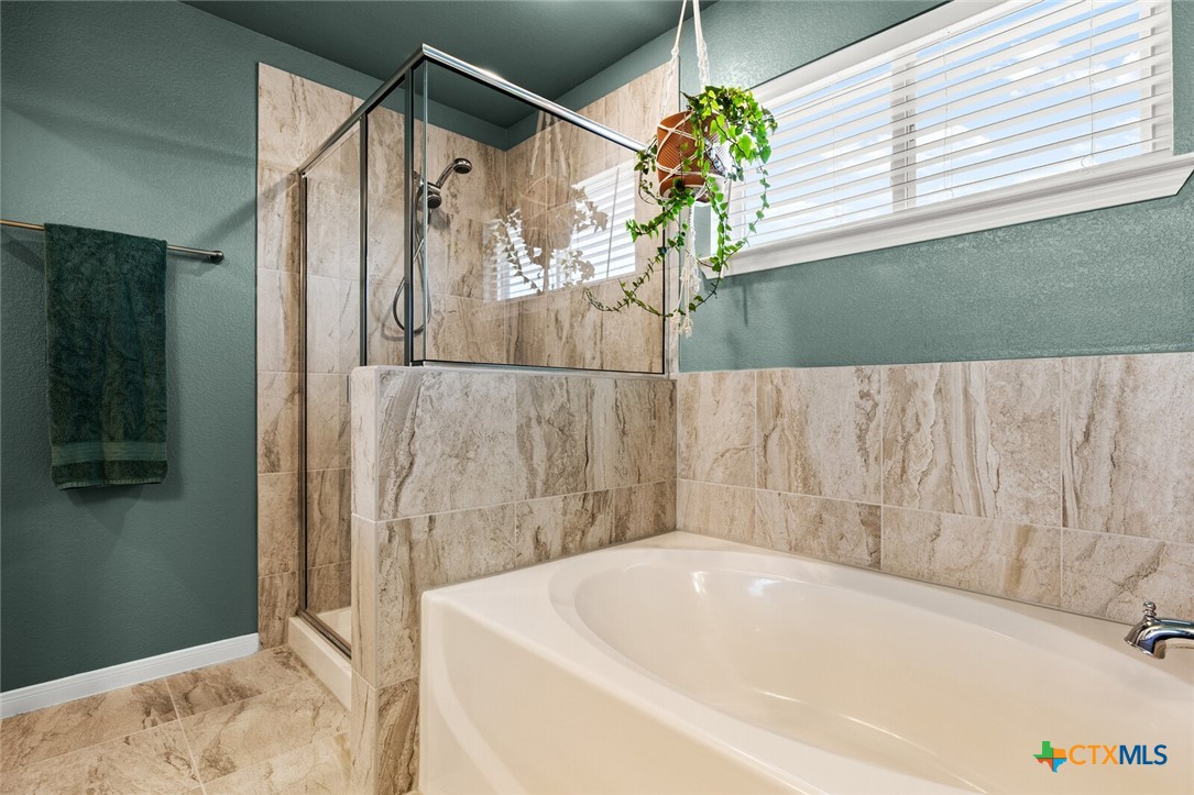 2233 Chia Court Temple, TX 76501 - Photo 35 of 47 a bathroom with a bathtub and a shower