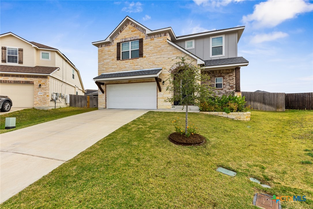 2233 Chia Court Temple, TX 76501 - Photo 4 of 47 a front view of a house with a yard