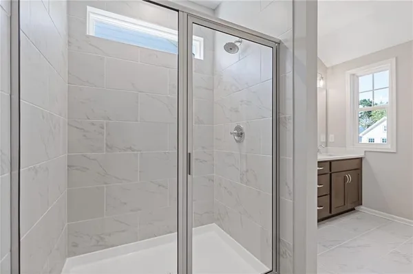 a bathroom with a bathtub and a shower
