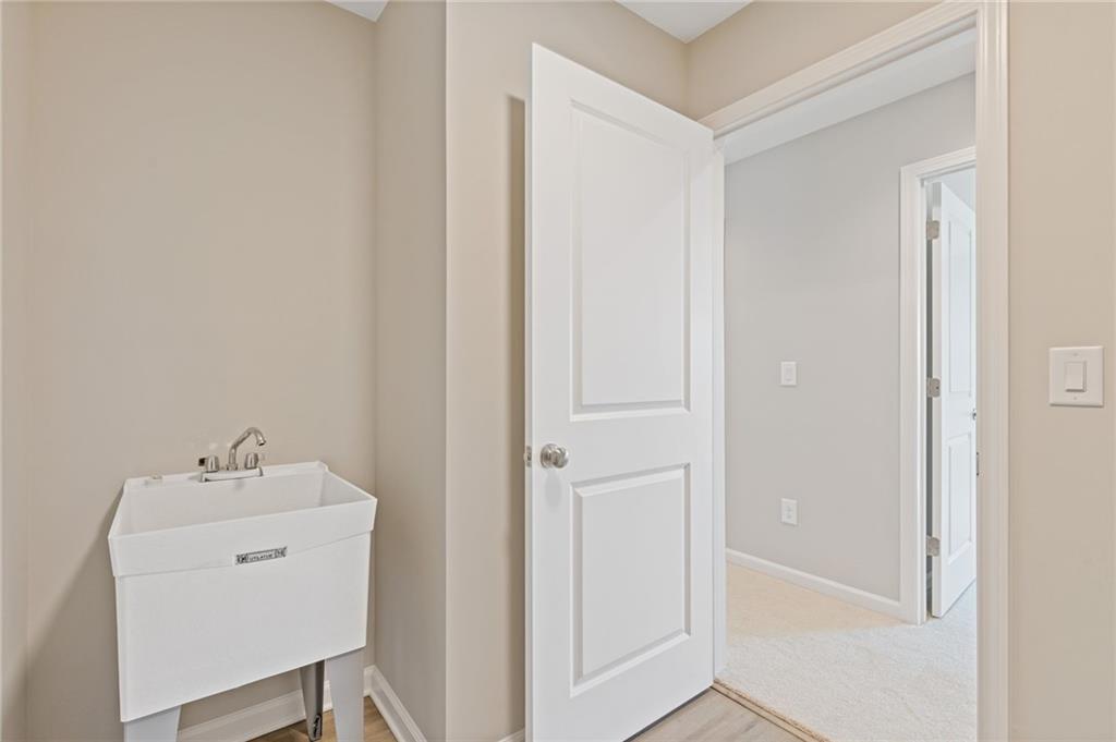 2716 Rylee Carter Street Dacula, GA 30019 - Photo 16 of 24 a utility room with dryer and washer