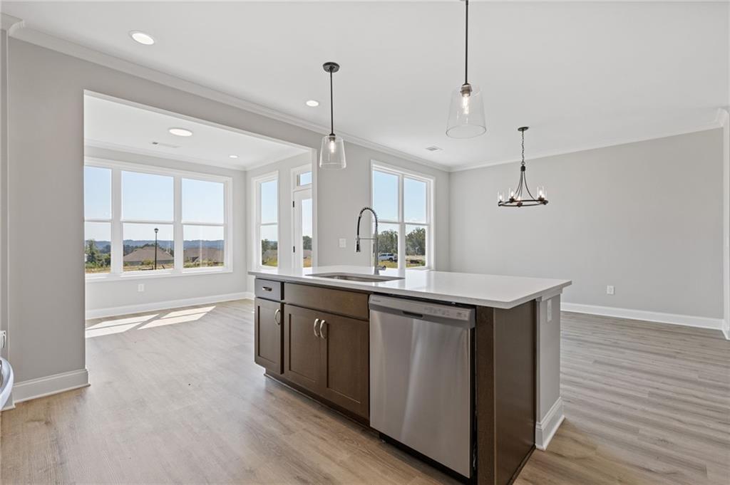 2716 Rylee Carter Street Dacula, GA 30019 - Photo 7 of 24 a large kitchen with kitchen island a large island in it