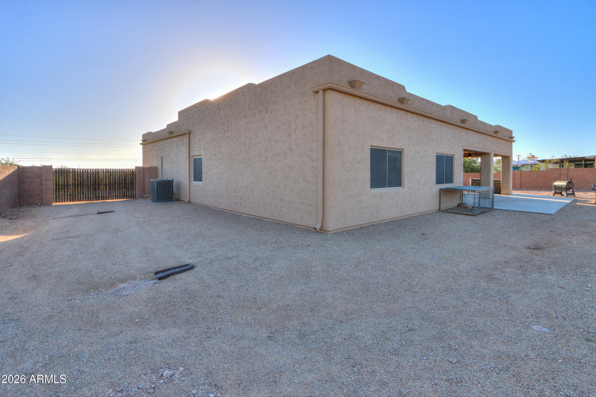 1487 South Mountain View Road Apache Junction, AZ 85119 - Photo 32 of 60 a view of a house with a backyard