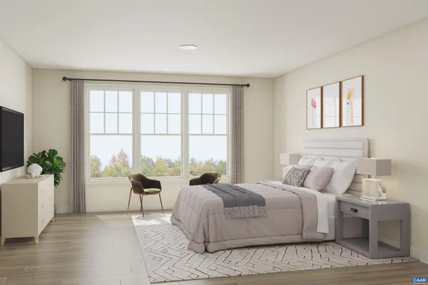 a spacious bedroom with a large bed and a large window