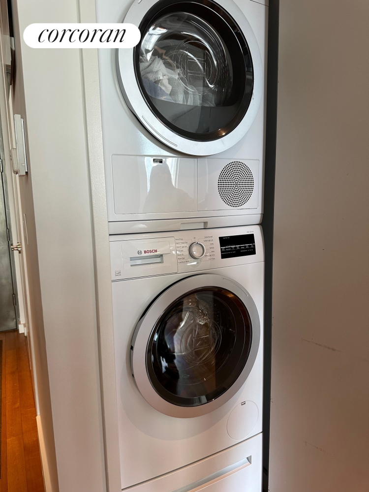 85 Adams Street, Unit 14C Brooklyn, NY 11201 - Photo 5 of 12 a utility room with dryer and washer
