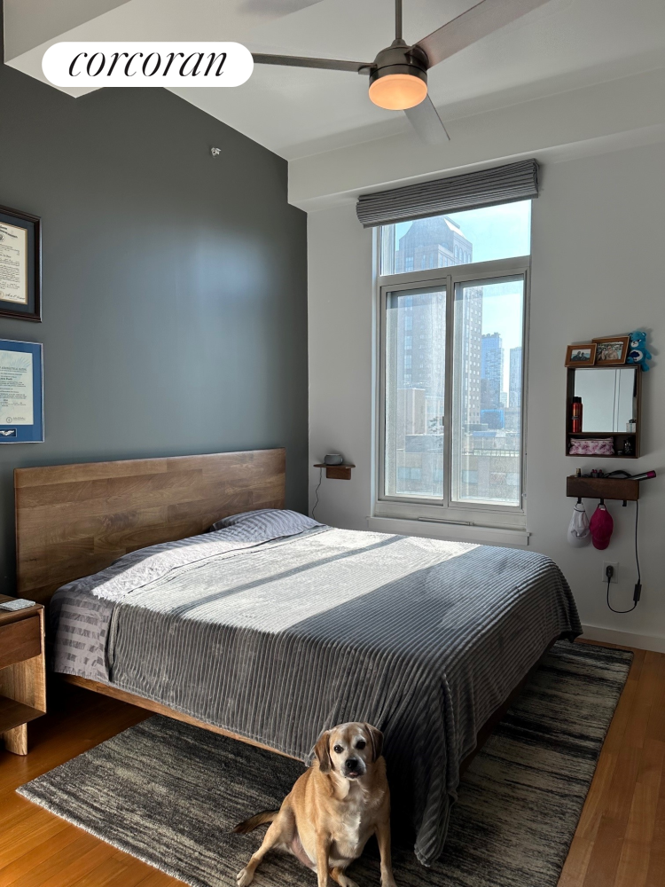 85 Adams Street, Unit 14C Brooklyn, NY 11201 - Photo 6 of 12 a bedroom with a bed and a large window