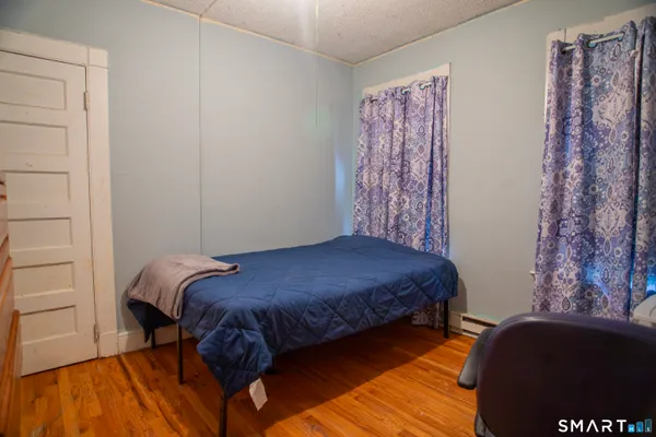 a bedroom with a bed and a closet