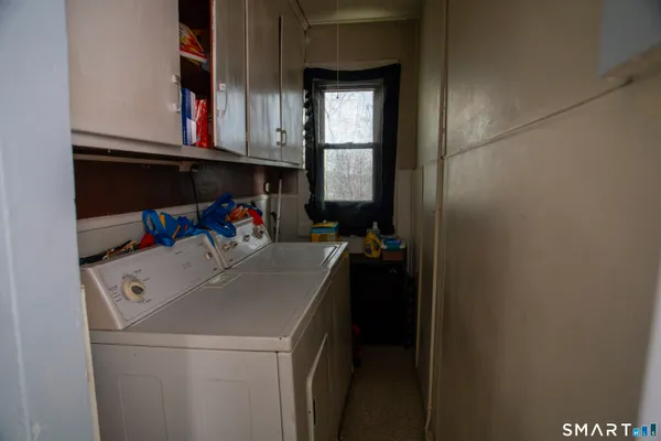a bedroom with a bed and a television