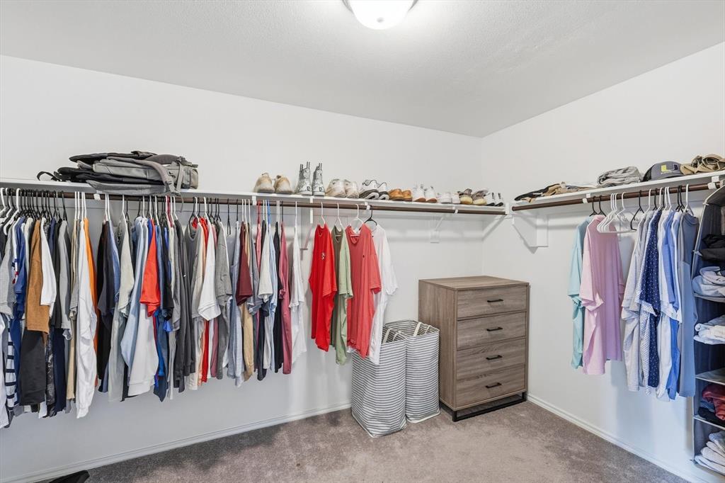16041 Pious Drive Haslet, TX 76052 - Photo 19 of 36 a view of walk in closet with clothes