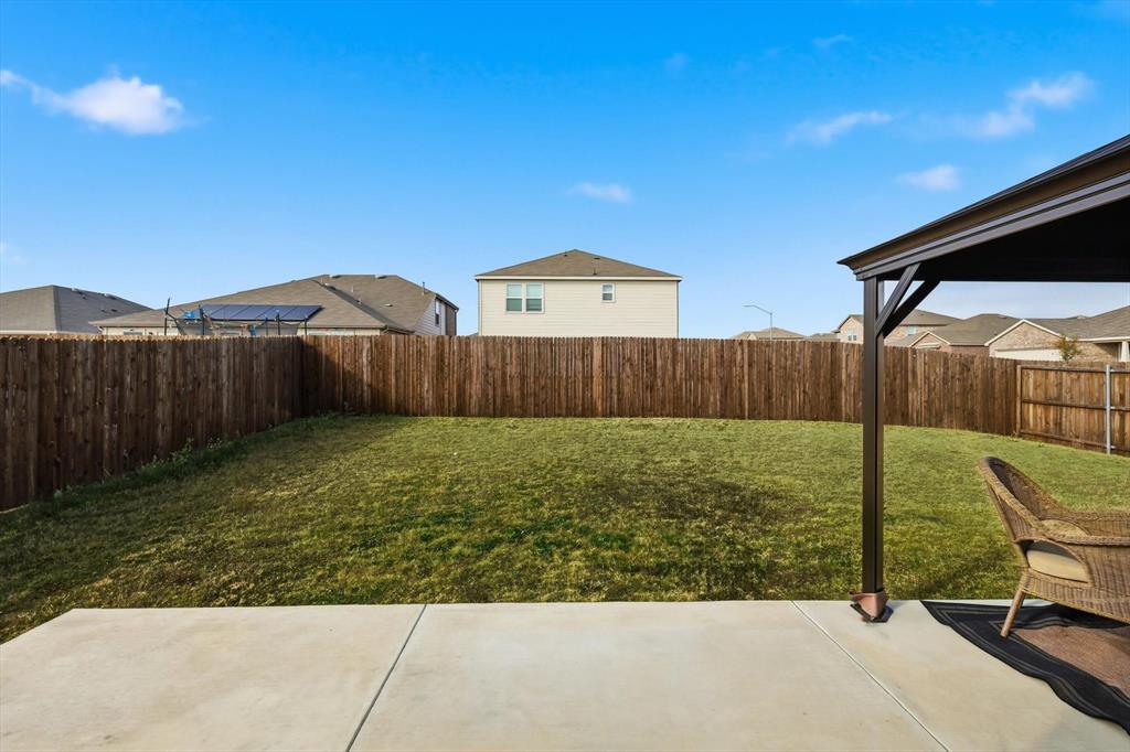 16041 Pious Drive Haslet, TX 76052 - Photo 24 of 36 a view of a backyard with wooden fence