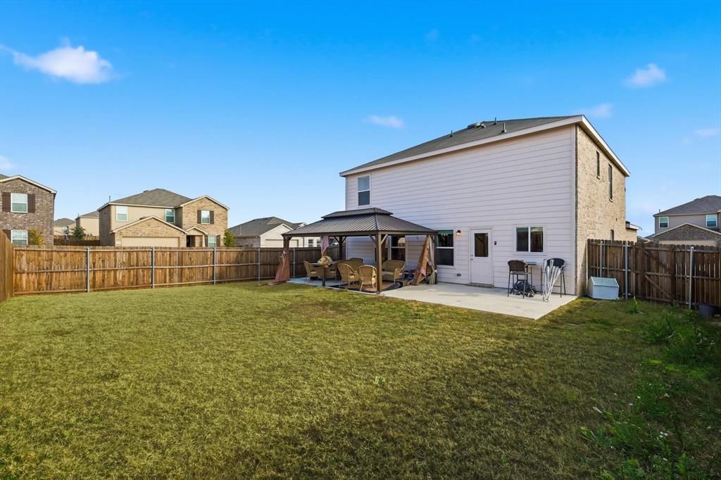 16041 Pious Drive Haslet, TX 76052 - Photo 25 of 36 a view of a house with backyard and sitting area