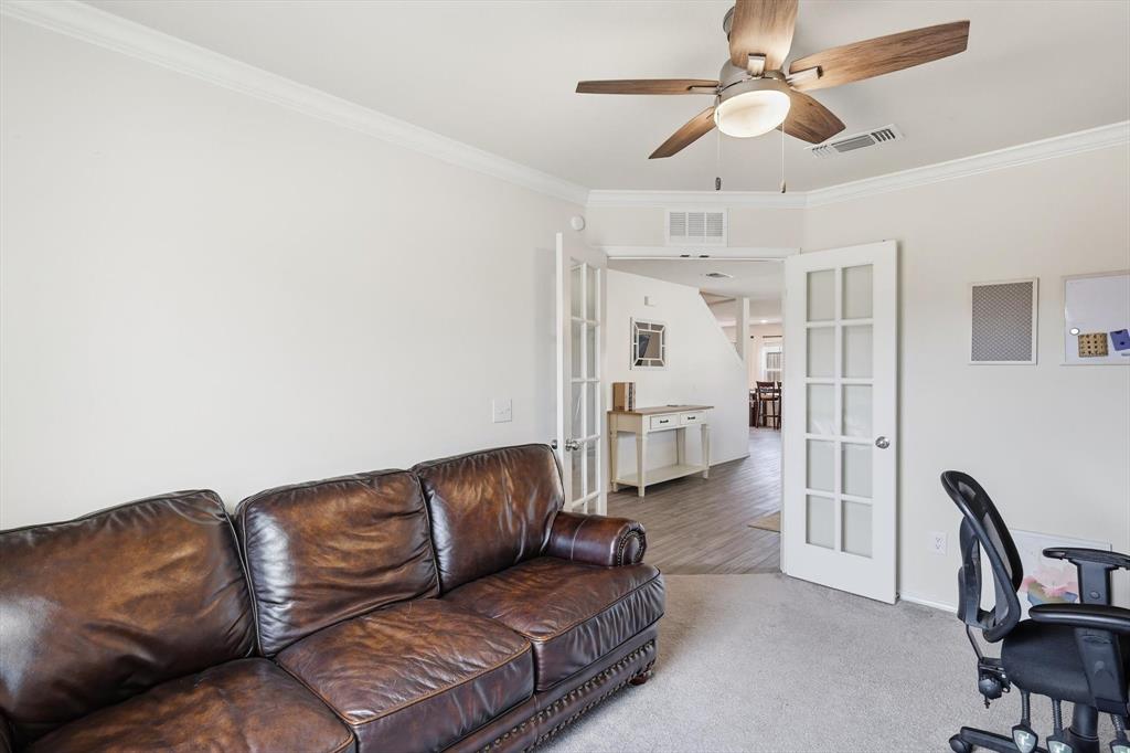 16041 Pious Drive Haslet, TX 76052 - Photo 4 of 36 a living room with furniture and a chandelier