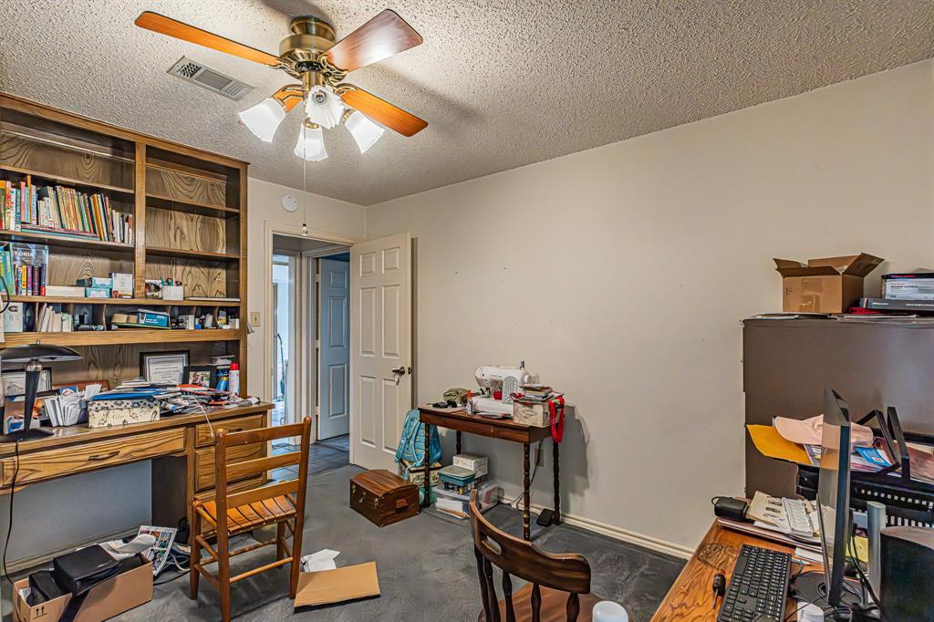 3309 Timber View Circle Bedford, TX 76021 - Photo 29 of 38 a view of a workspace with furniture and a bookshelf