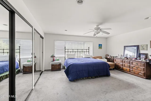 a bed room with a bed and a couch