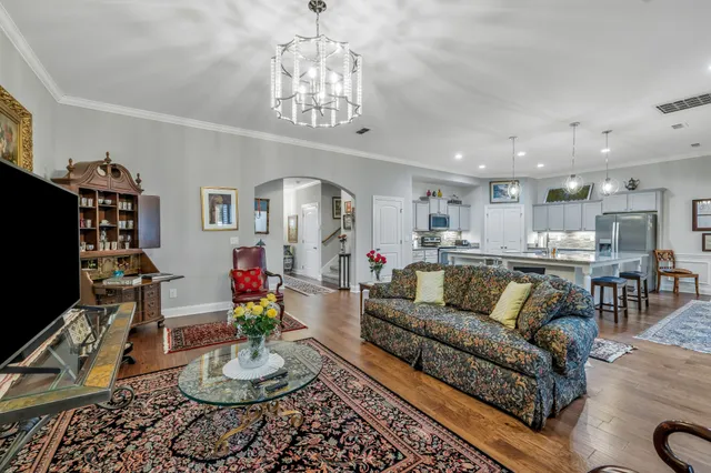 a kitchen with lots of counter space a sink appliances and cabinets