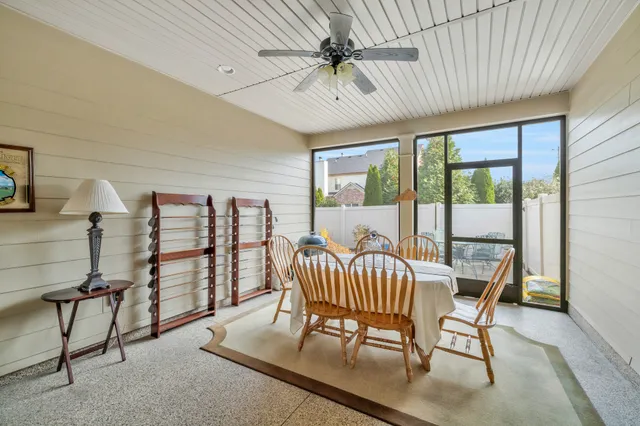 a balcony with furniture and a potted plant
