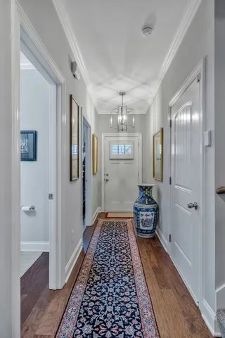 a living room with furniture a rug and a book shelf