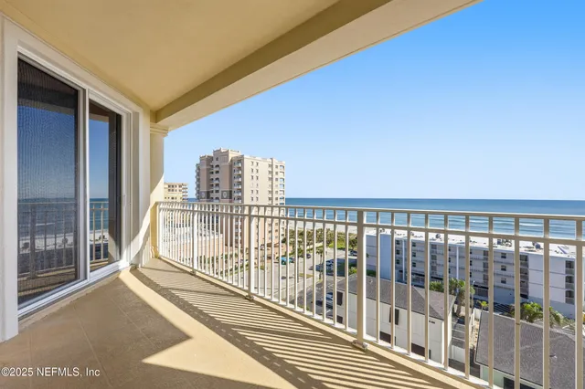 a view of a palm trees front of a house