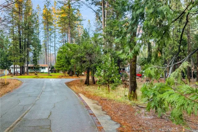 a view of swimming pool with sitting area and garden