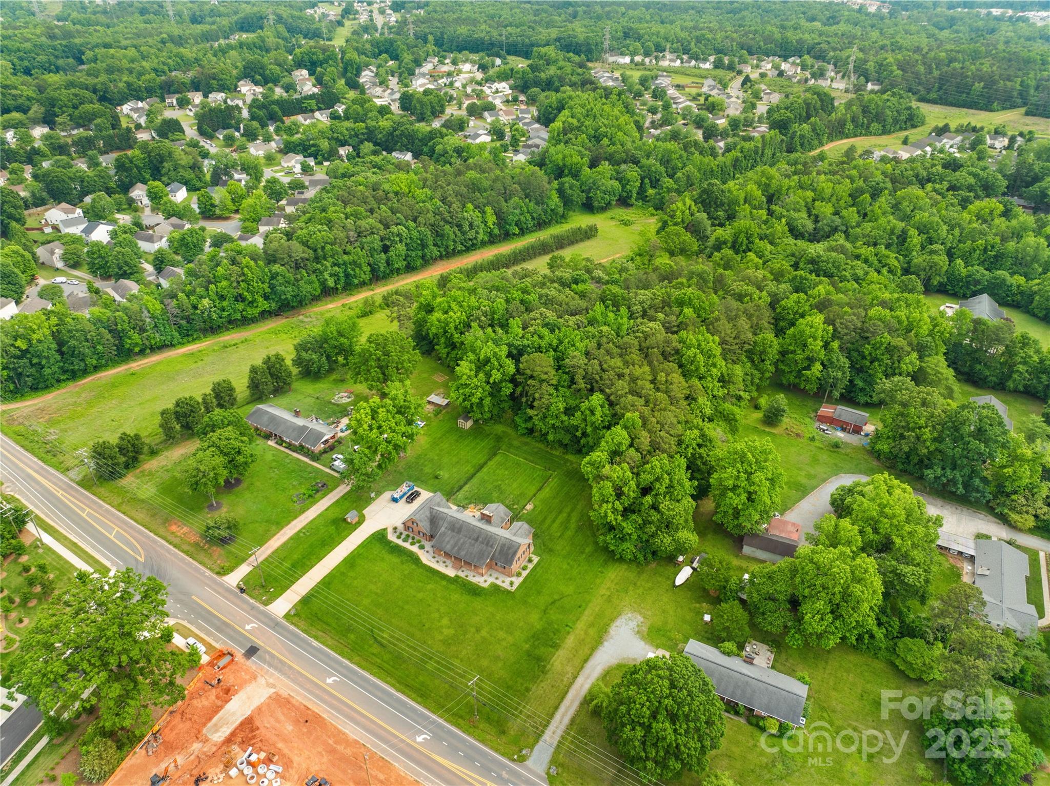 6411 Pleasant Grove Road Charlotte, NC 28216 - Photo 7 of 18 a view of a backyard with plants