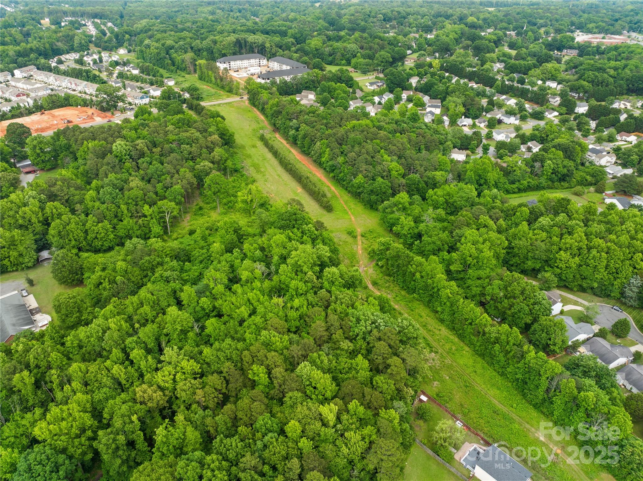 6411 Pleasant Grove Road Charlotte, NC 28216 - Photo 8 of 18 a view of a lush green field