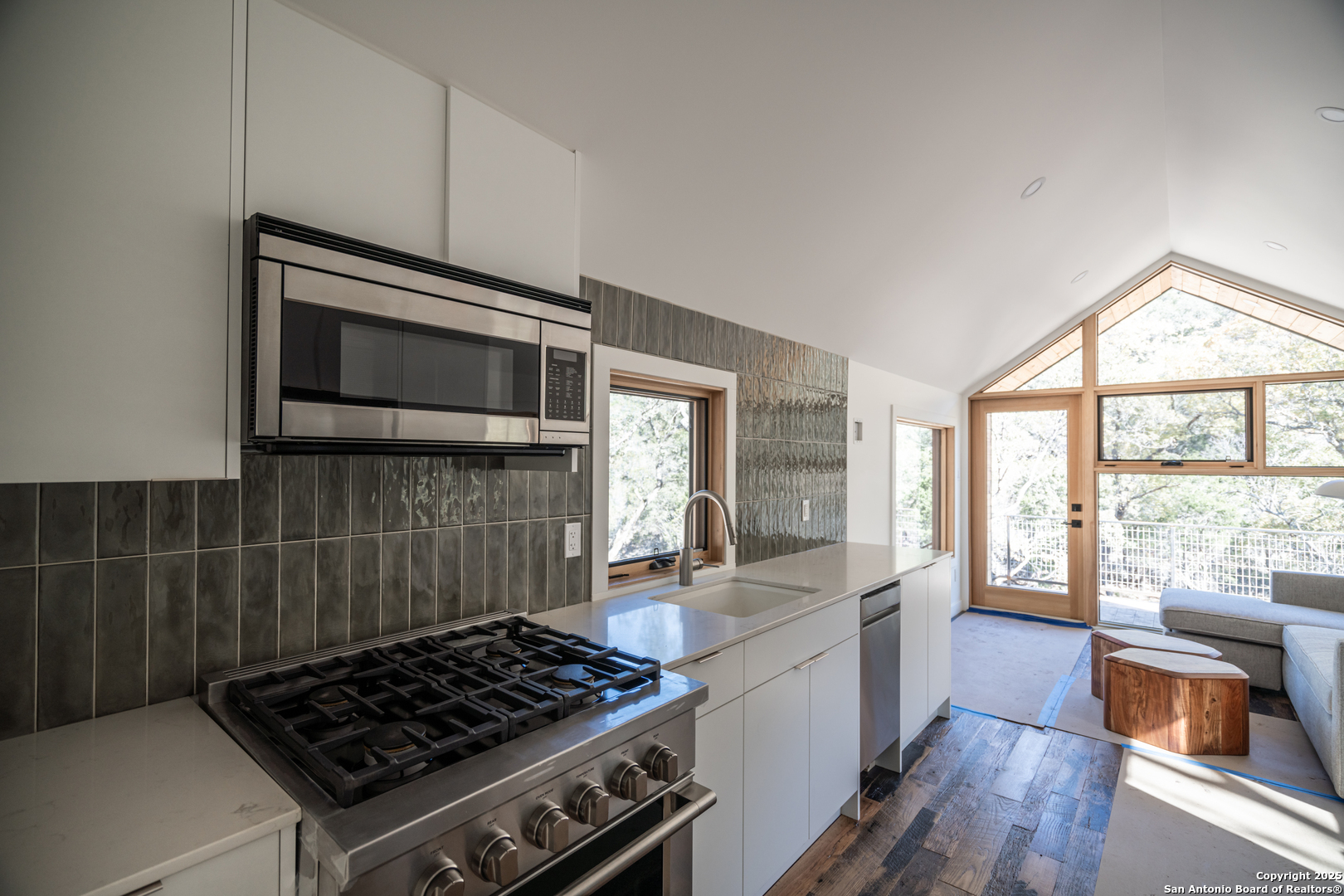 83 Leakey Tx 78873 Leakey, TX 78873 - Photo 16 of 38 a kitchen with a stove and a microwave