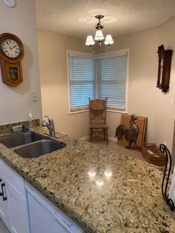 a kitchen with a sink and a stove