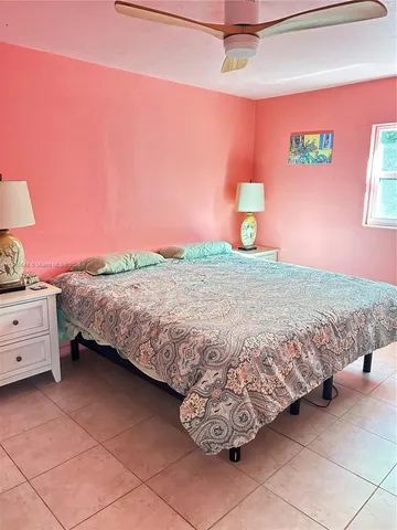 a bedroom with a bed and dresser