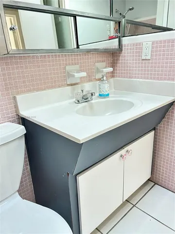 a bathroom with a sink and a toilet