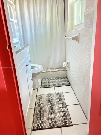a bathroom with a sink and a rug
