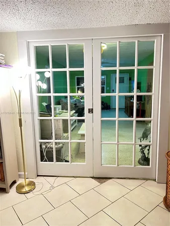 a view of front door with yard