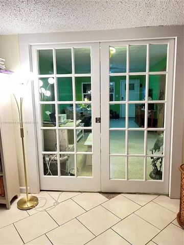 a view of front door with yard