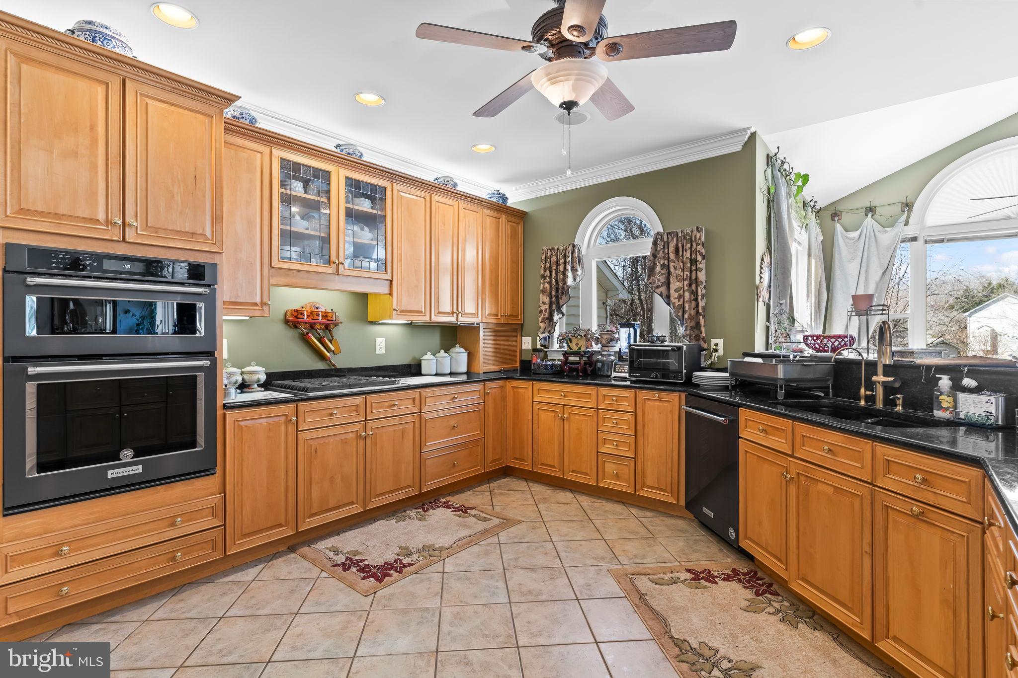 5 Cross Point Drive Owings, MD 20736 - Photo 11 of 63 a large kitchen with stainless steel appliances granite countertop a stove a sink and a microwave