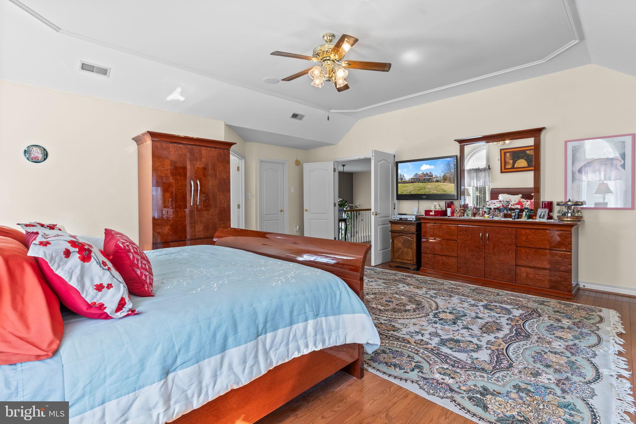 5 Cross Point Drive Owings, MD 20736 - Photo 24 of 63 a bedroom with a bed and a chandelier