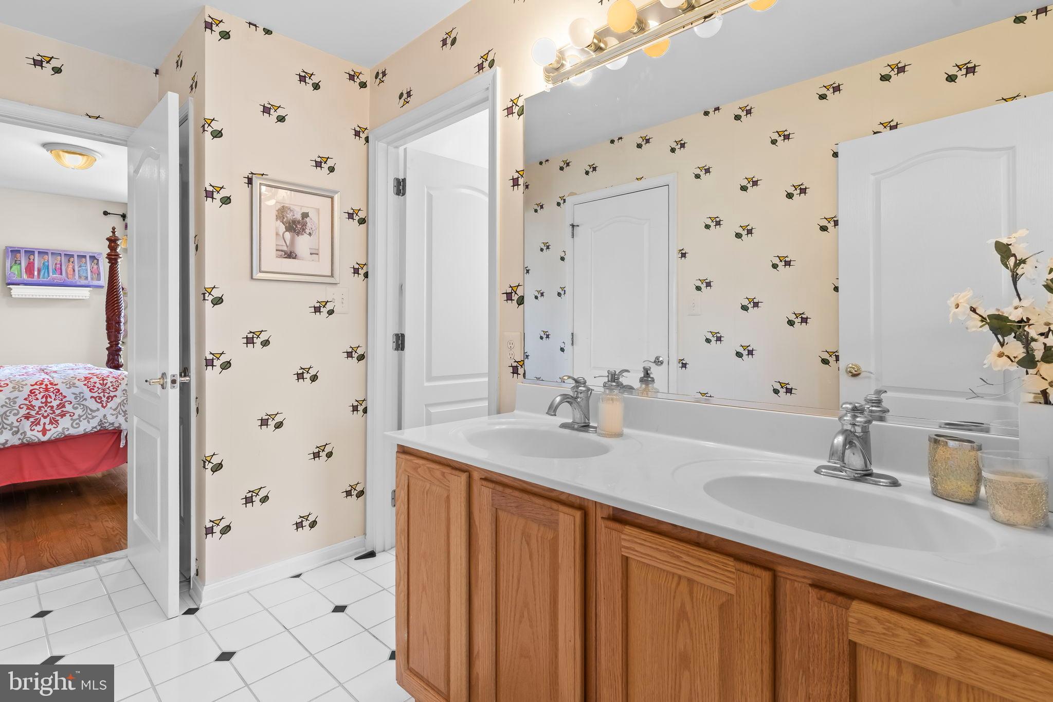 5 Cross Point Drive Owings, MD 20736 - Photo 27 of 63 a bathroom with a sink double vanity and a shower