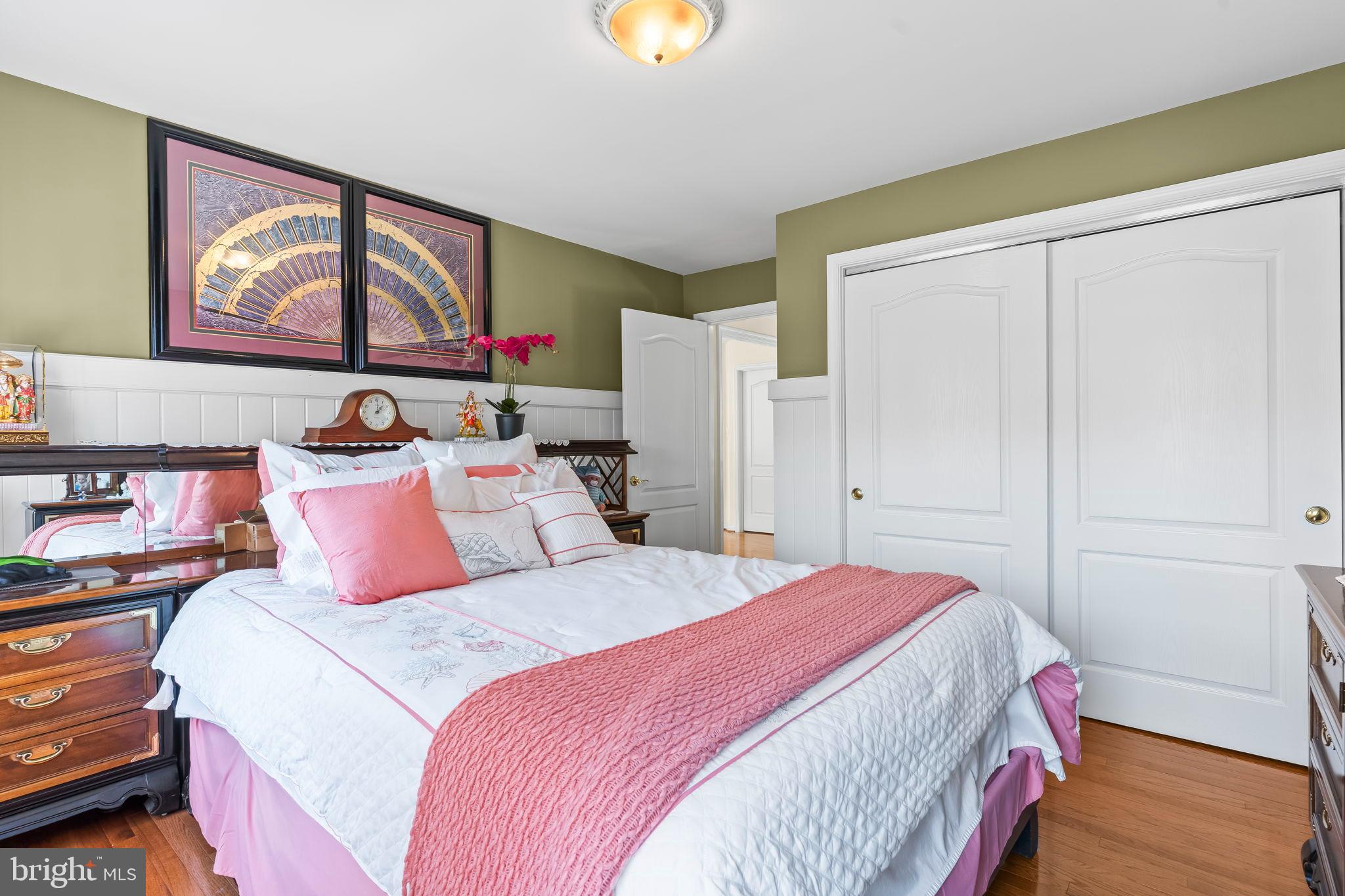 5 Cross Point Drive Owings, MD 20736 - Photo 29 of 63 a bedroom with a bed and a painting on the wall