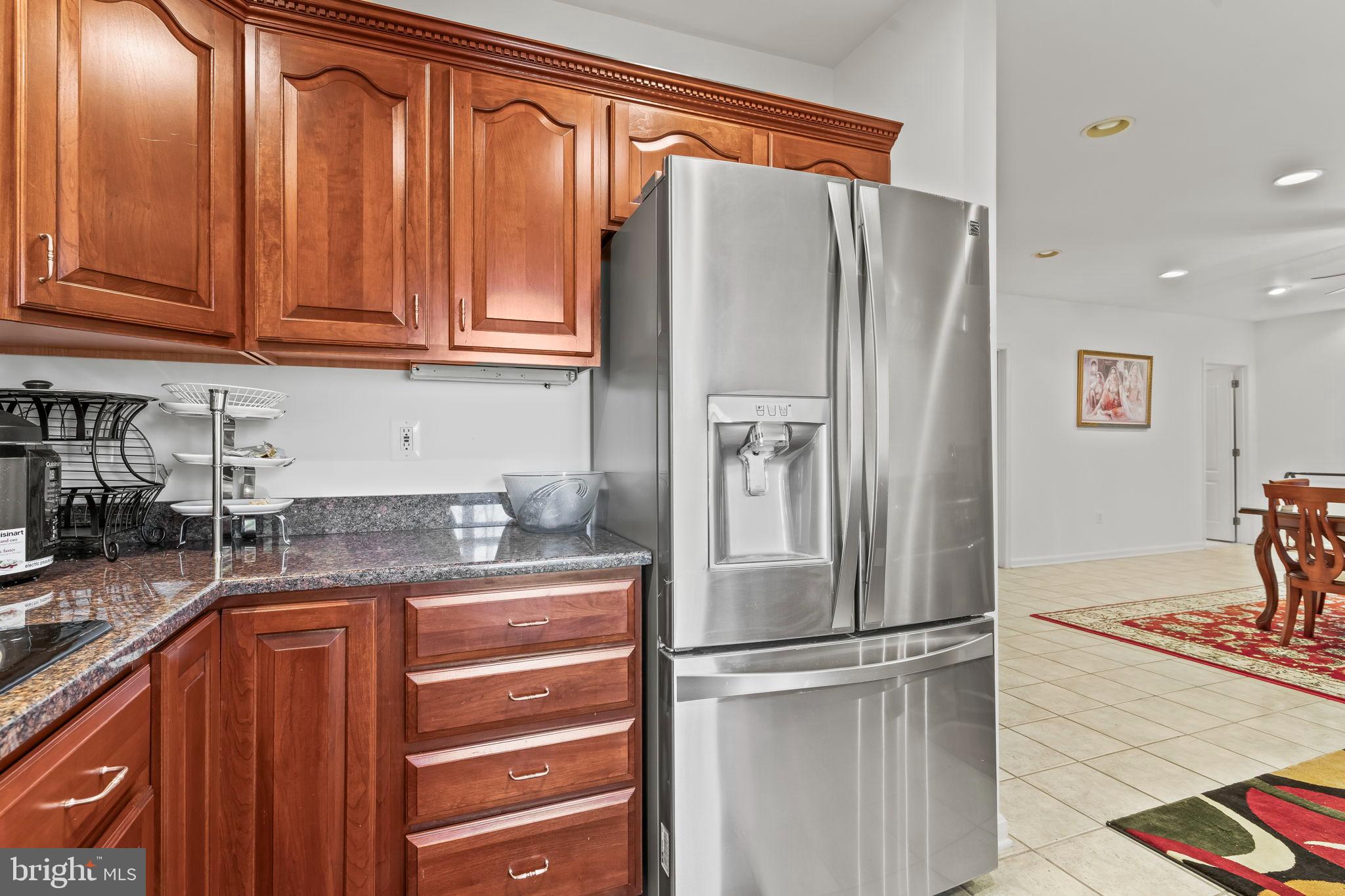 5 Cross Point Drive Owings, MD 20736 - Photo 40 of 63 a kitchen with stainless steel appliances granite countertop a refrigerator and a sink