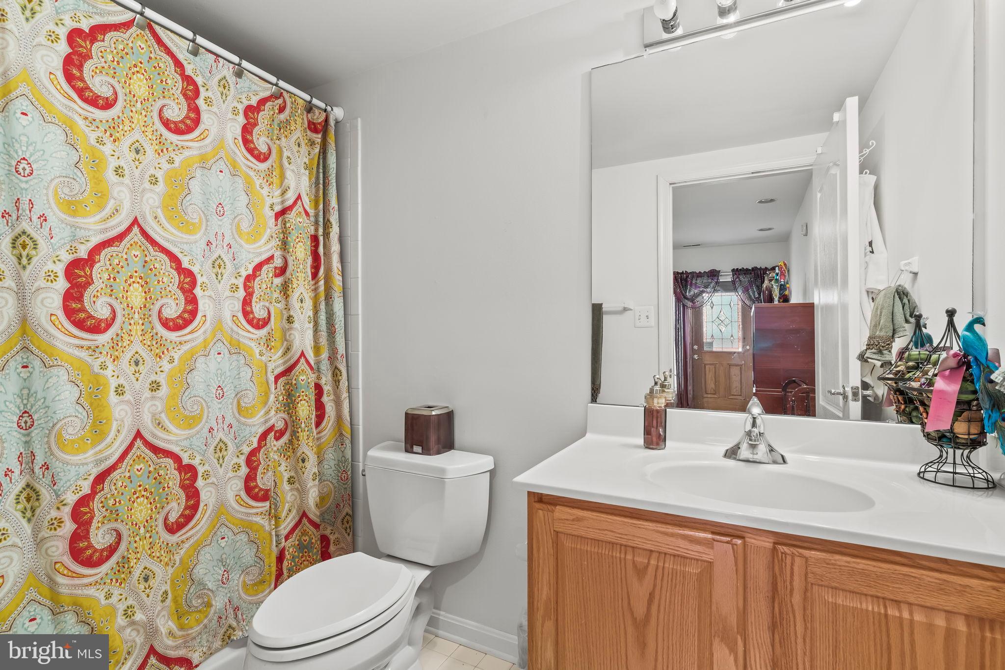 5 Cross Point Drive Owings, MD 20736 - Photo 42 of 63 a bathroom with a sink and mirror with toilet