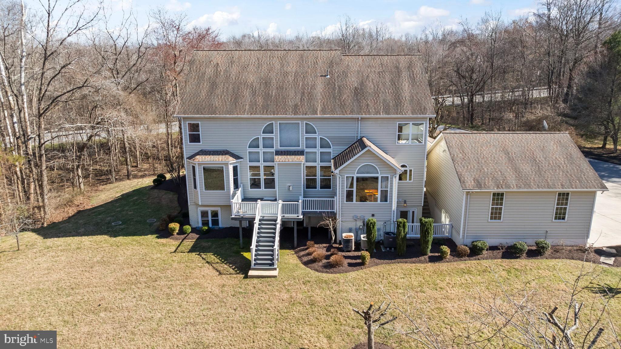 5 Cross Point Drive Owings, MD 20736 - Photo 56 of 63 a view of a house with a yard and sitting area