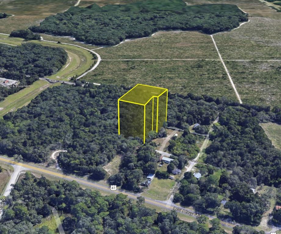 Tbd Putter Lane Spring Hill, FL 34610 - Photo 8 of 8 a aerial view of a house with a yard