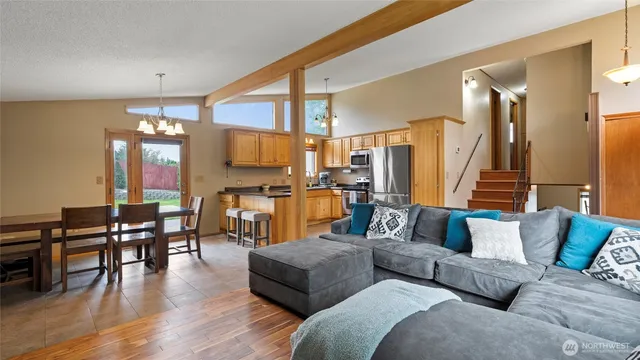 a view of a hallway with windows and closet