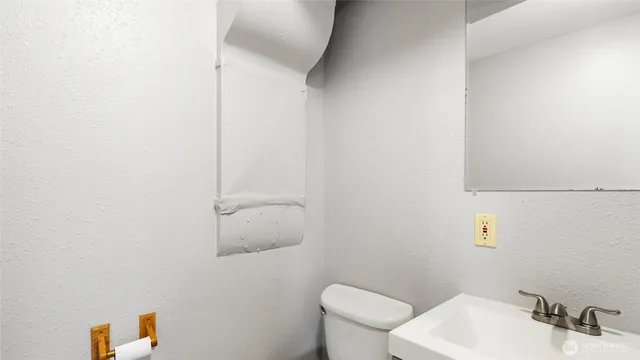 a bathroom with a sink and cabinets