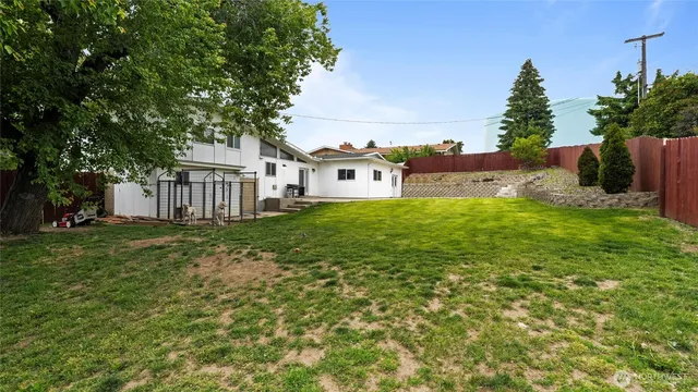 an aerial view of a house with a garden and plants