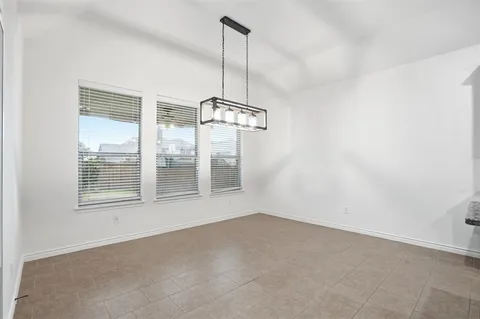 a kitchen with stainless steel appliances granite countertop a sink and a stove